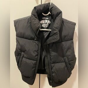 This adorable mini vest from Garage is available in size XS and comes in black.